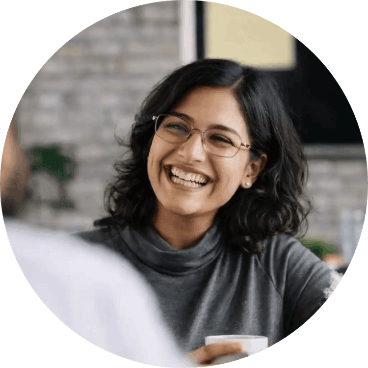 Girl smiling with coffee mug